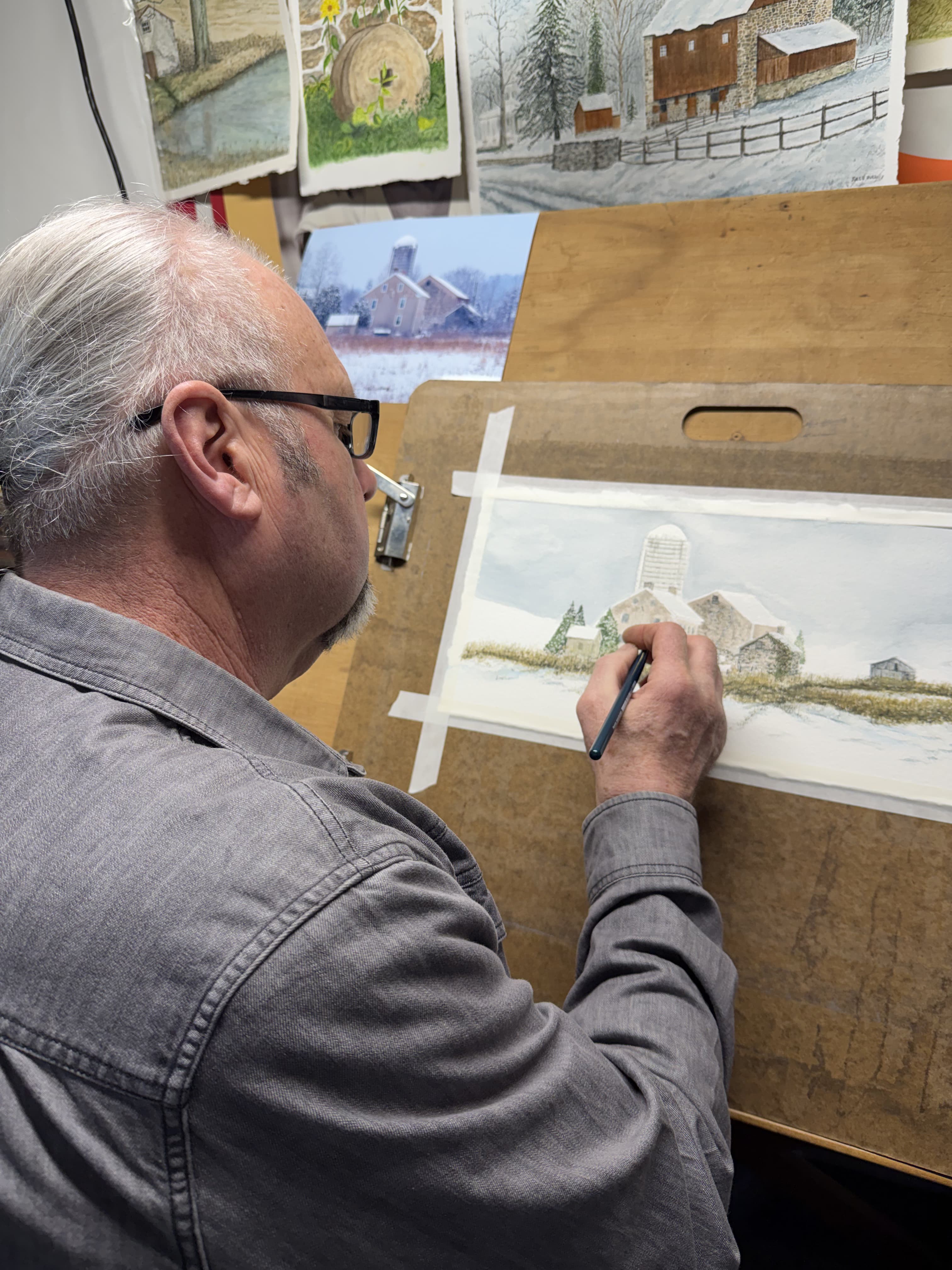 Jules Hull painting at his easel